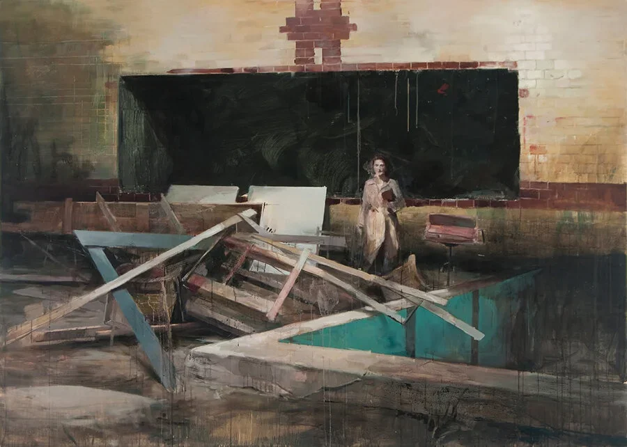 A painting featuring a damaged classroom with a collapsed ceiling, broken desks, and a woman standing near a blackboard.