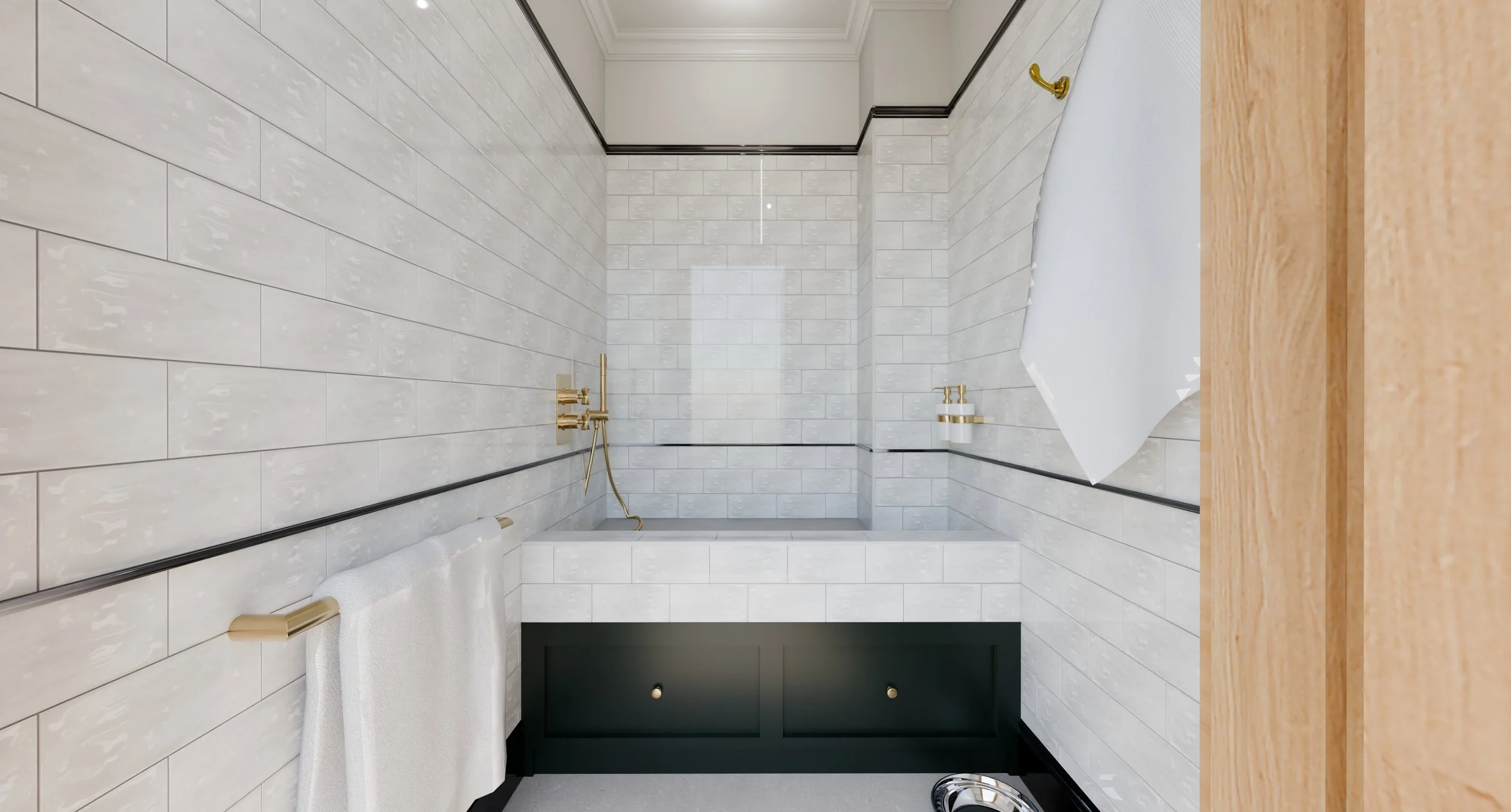 A modern bathroom with white marble subway tiles on the walls, a wooden countertop, a white towel hanging on a gold towel rod, and gold fixtures including a faucet and showerhead.