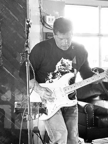 Tino from Lucy's Fur Baby rockin out on the guitar