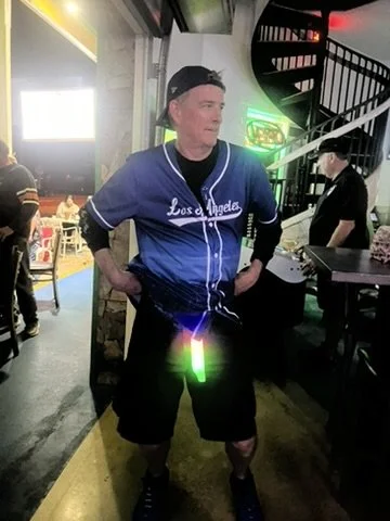 One of Lucy's Fur Baby's loyal fans having fun with glow sticks