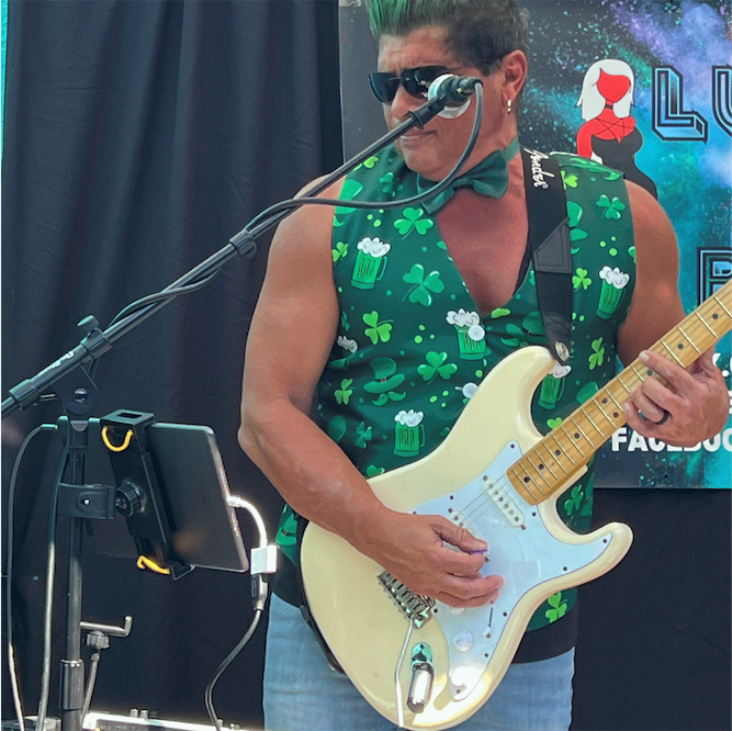 Tino from Lucy's Fur Baby rockin out on St. Patty's Day