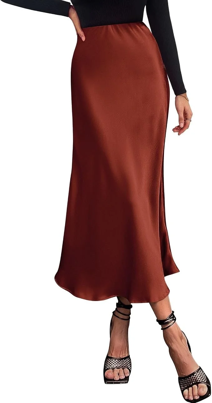A woman wearing a black long-sleeve top, a rust-colored satin maxi skirt, and black strappy high heels.