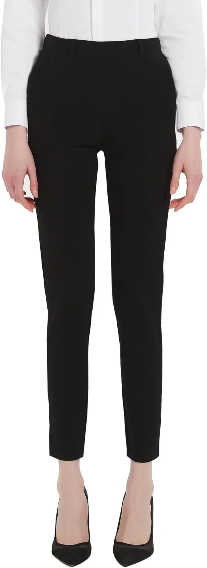 A person in black dress pants, a white shirt, and black heels, standing with arms relaxed by their sides.