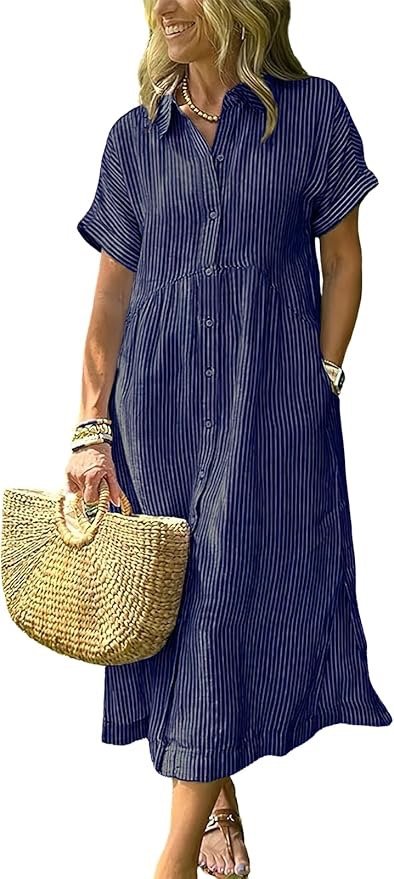 Woman wearing a blue and white striped button-up maxi dress, holding a straw handbag, with jewelry including bracelets and a necklace, smiling with blonde hair.