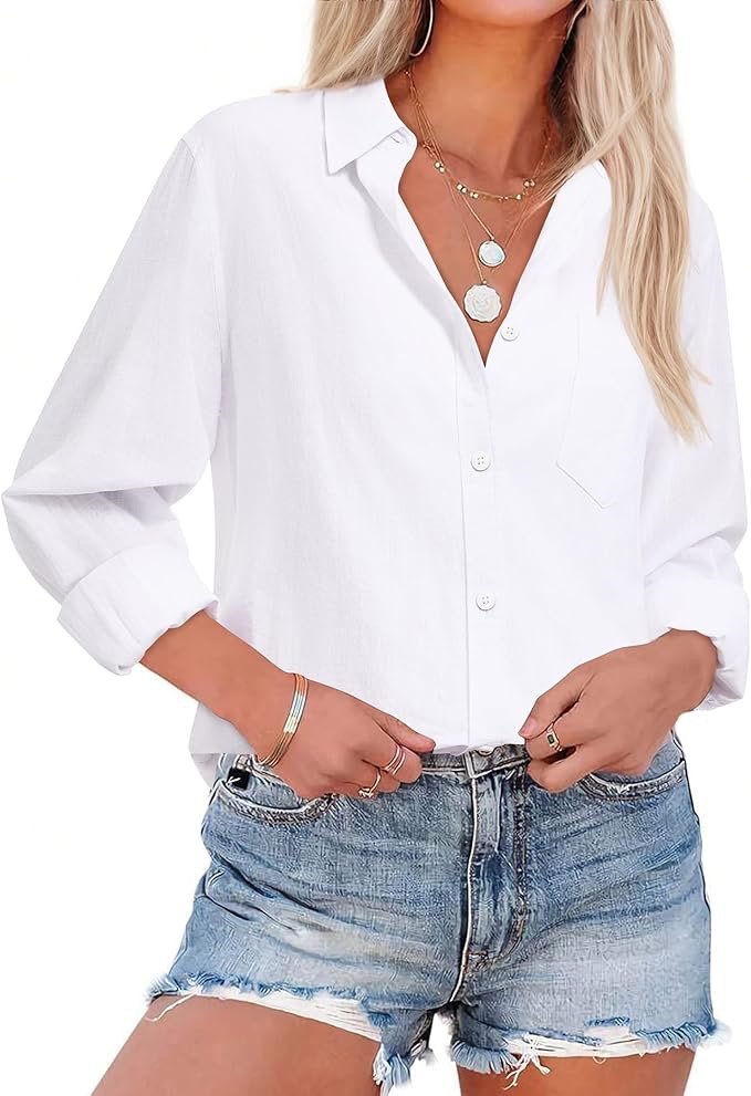 Woman wearing a white button-up shirt, denim shorts, and layered necklaces.