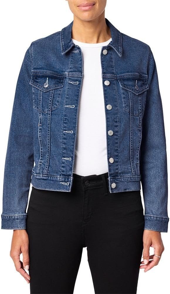 Woman wearing a blue denim jacket over a white t-shirt and black pants.