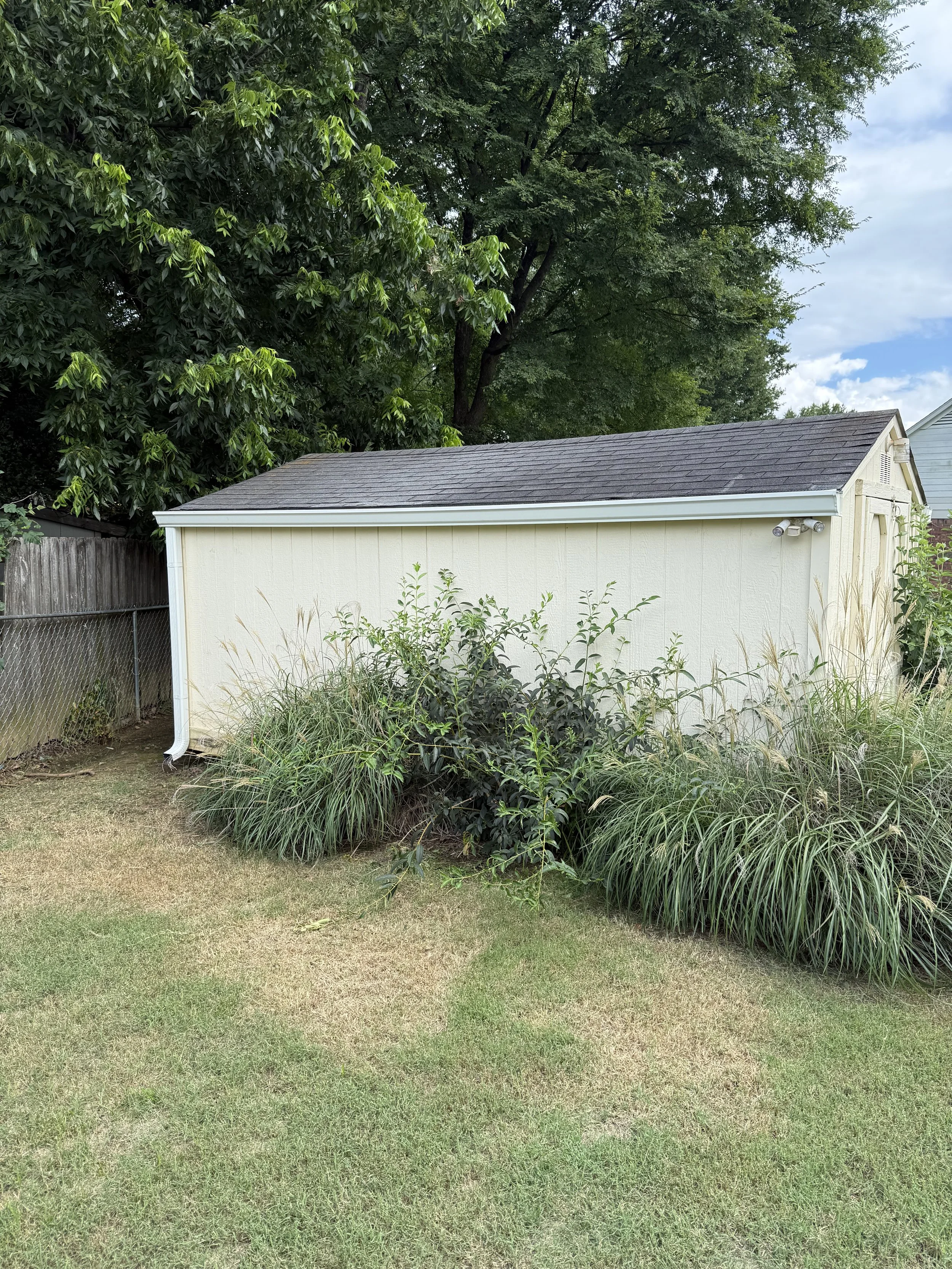 Seamless gutter system custom fit to the storage shed to efficiently direct rainwater away from the structure.