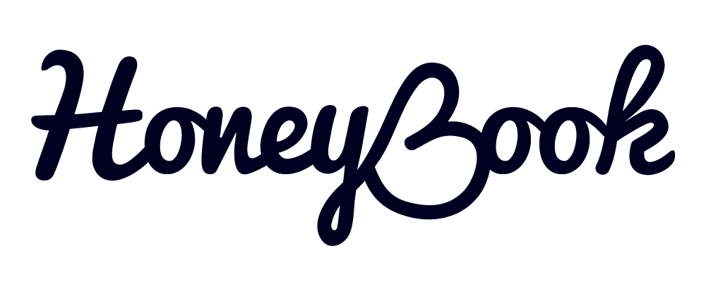 The text 'HoneyBook' written in a dark script font on a dark background.
