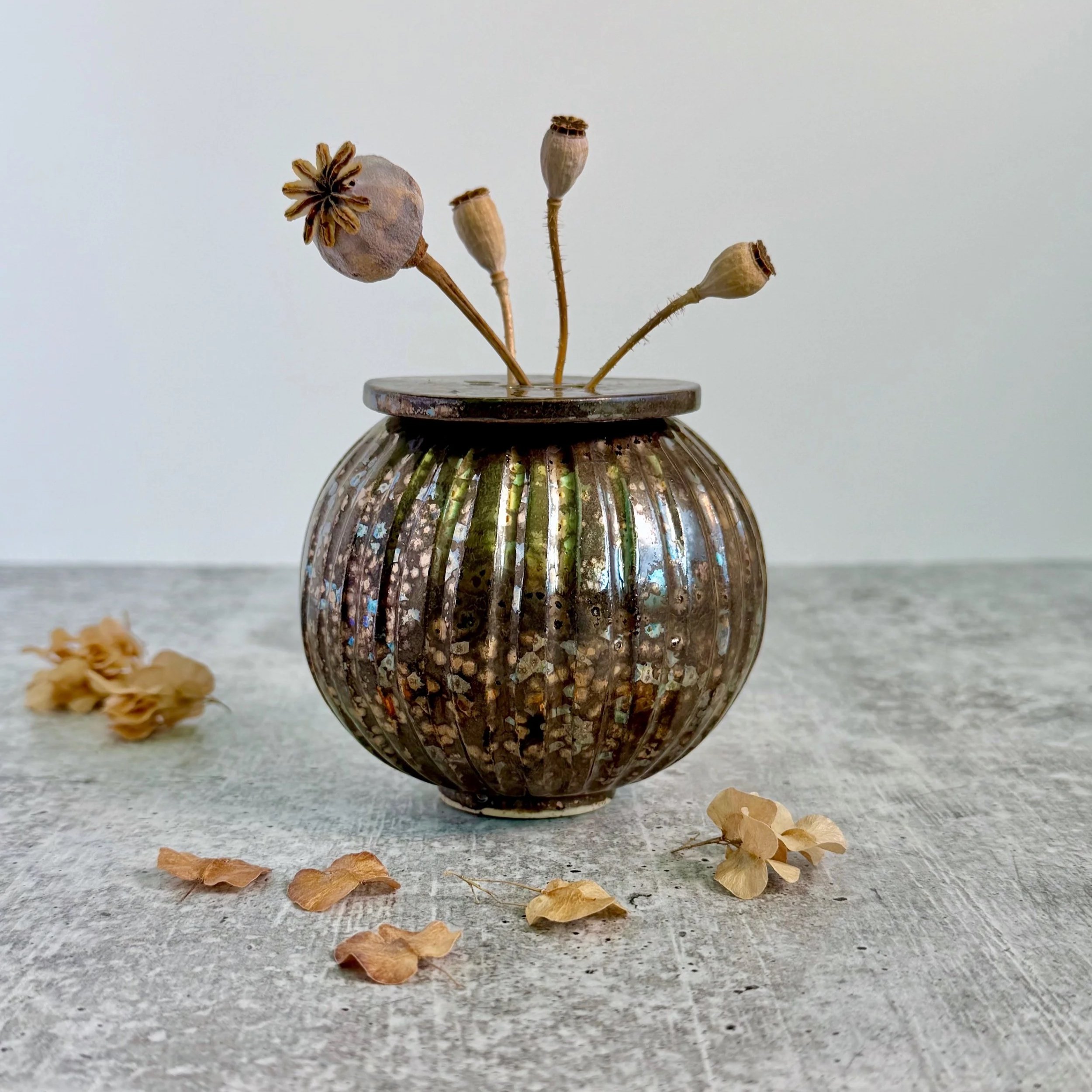 Metallic p
oppy vase with flower frog top