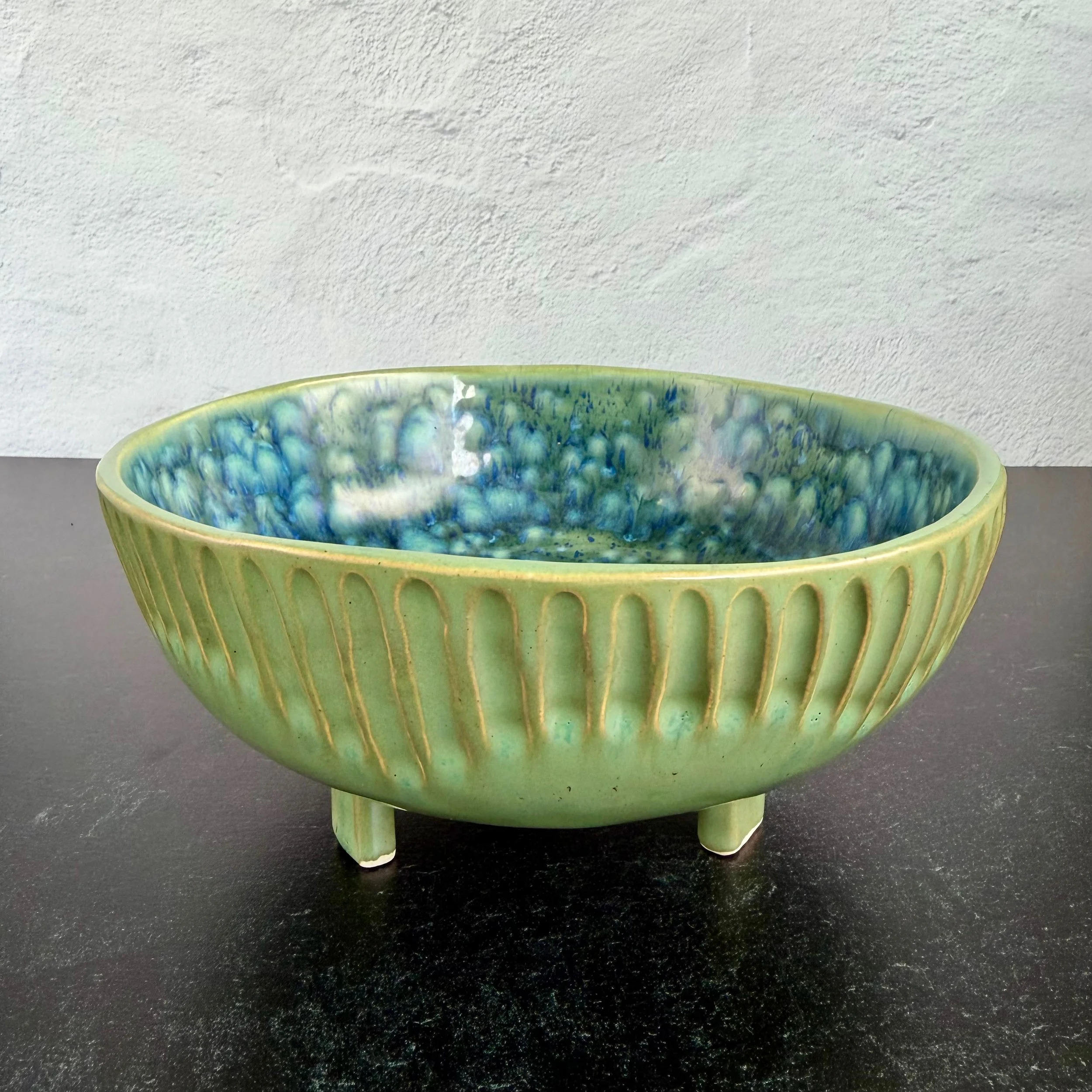footed bowl with hand-carved pattern