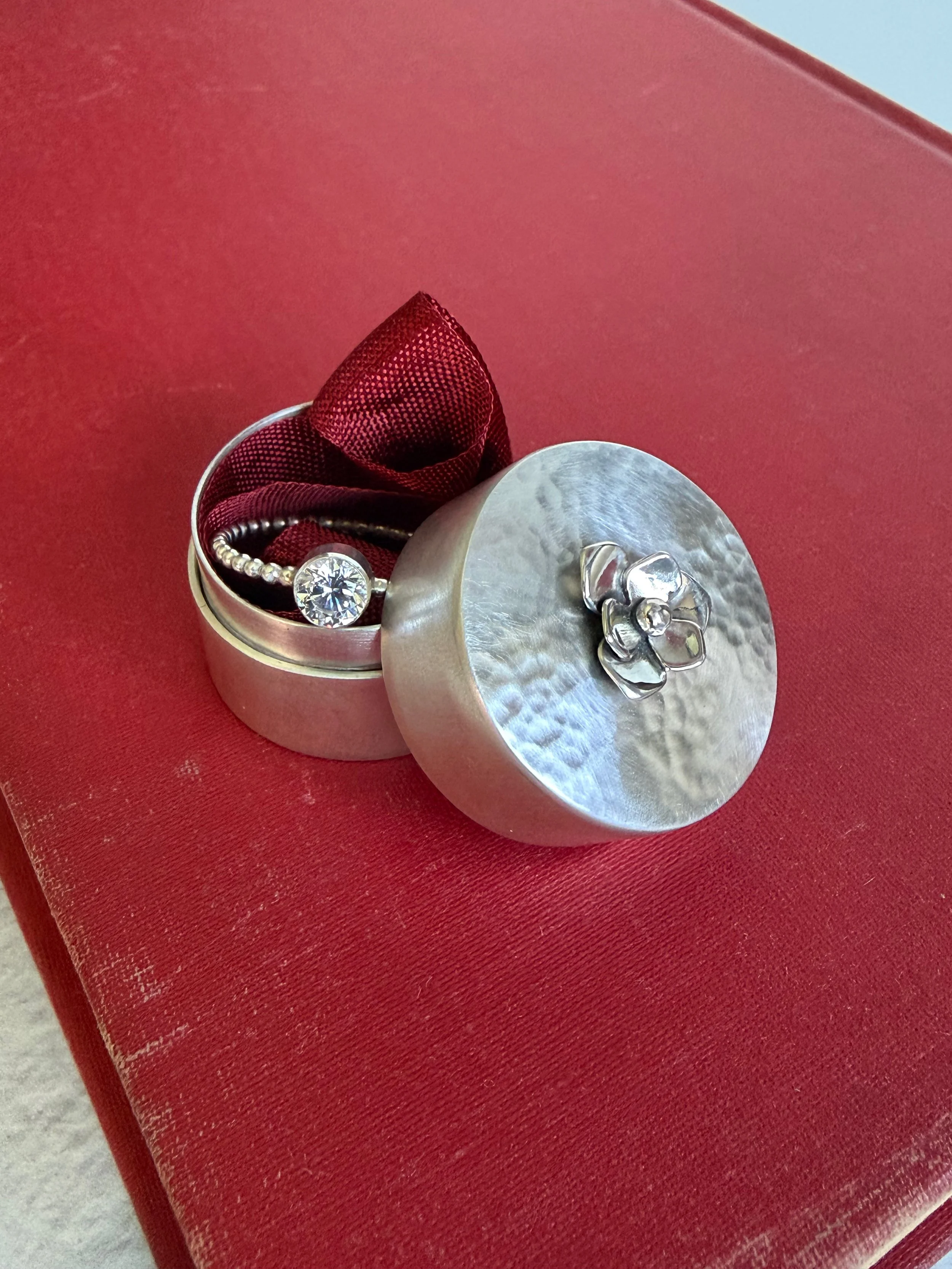 hand-fabricated sterling silver ring box with flower detail