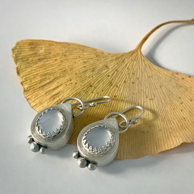 hand fabricated hollow form teardrop earrings with chalcedony