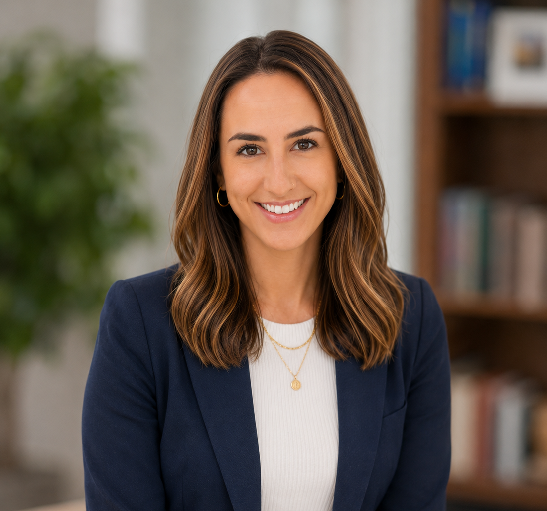 Portrait of a smiling woman with long, wavy brown hair. She is a learning specialist, tutor, family advocate, consultant, and expert in inclusive education at schools in NYC, San Francisco, and around the world at international schools.