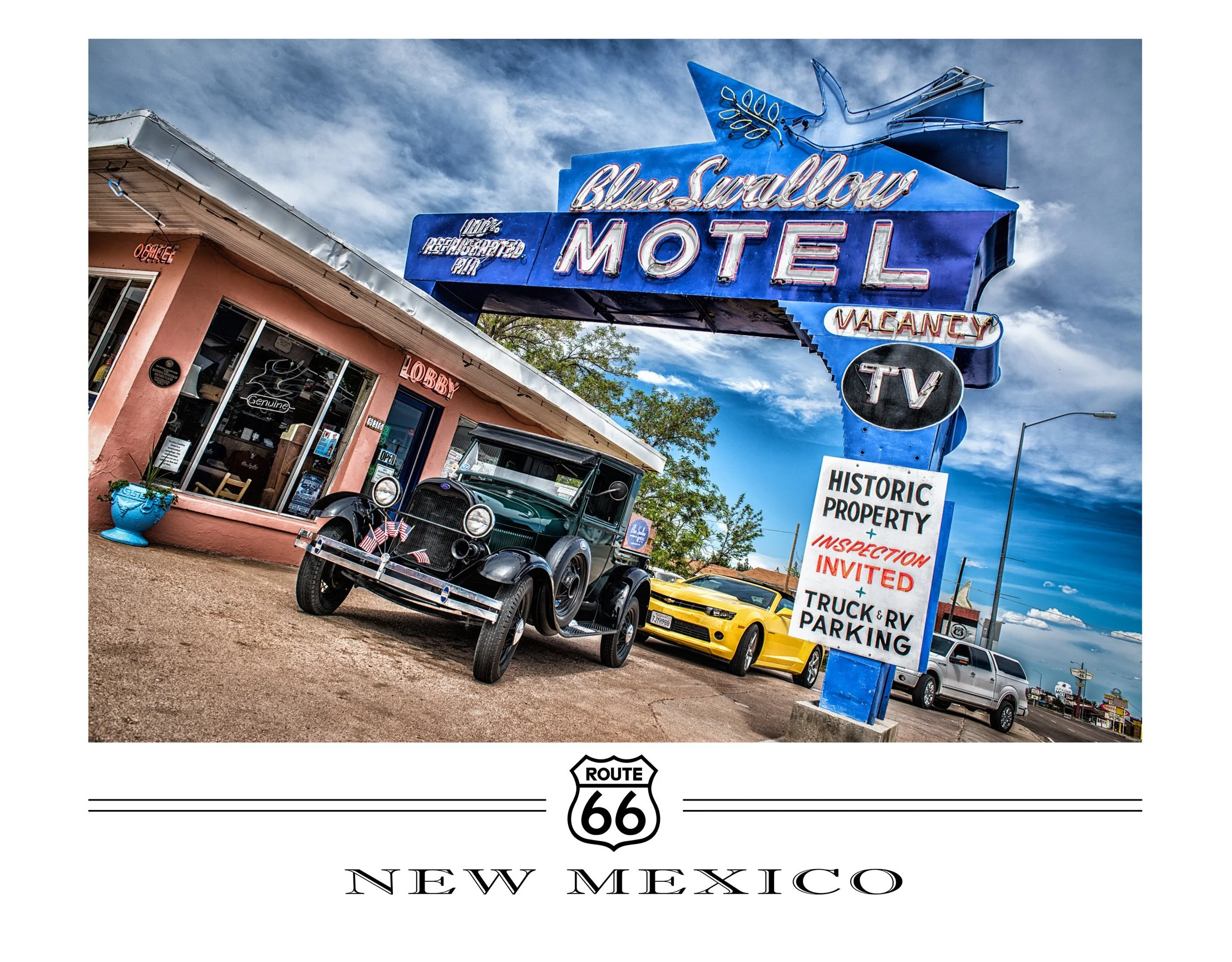 Vintage cars parked outside a roadside motel with a large neon sign reading 'Blue Swallow Motel' on Route 66 in New Mexico, with a pink building labeled 'Lobby' and a sign indicating historic property, inspection invited, and parking for trucks and RVs.
