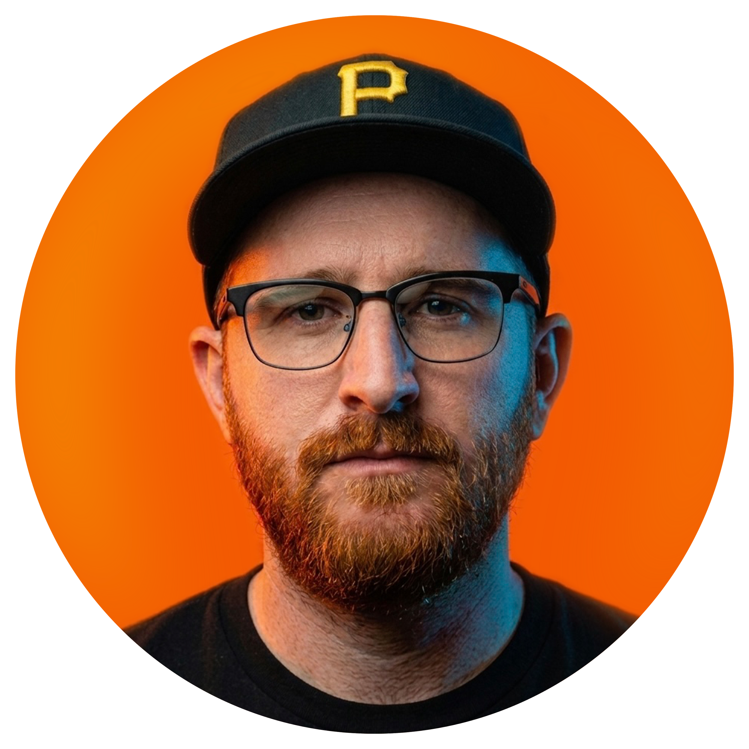 A person with glasses and a beard wearing a black baseball cap with a yellow P logo, against an orange background.