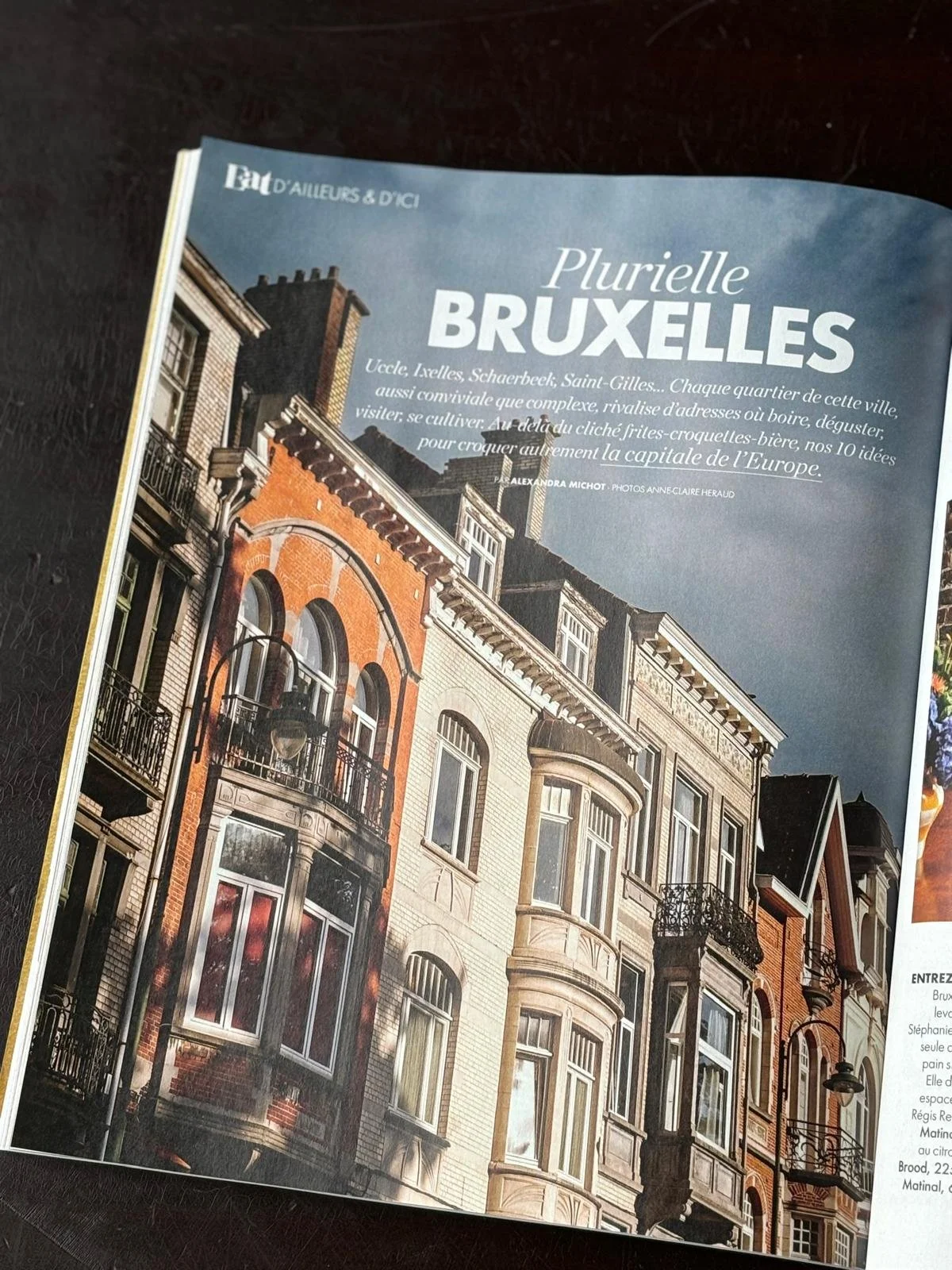 A magazine page featuring buildings in Brussels, with a blue sky background.