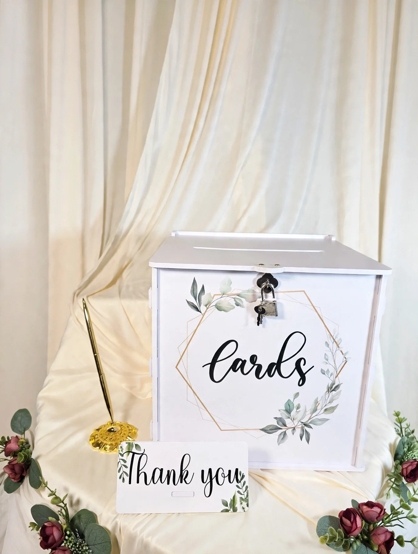 White card box with thank you sign, gold pen, and burgundy floral accents