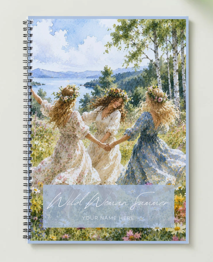 three women in flower crowns dancing by a lake