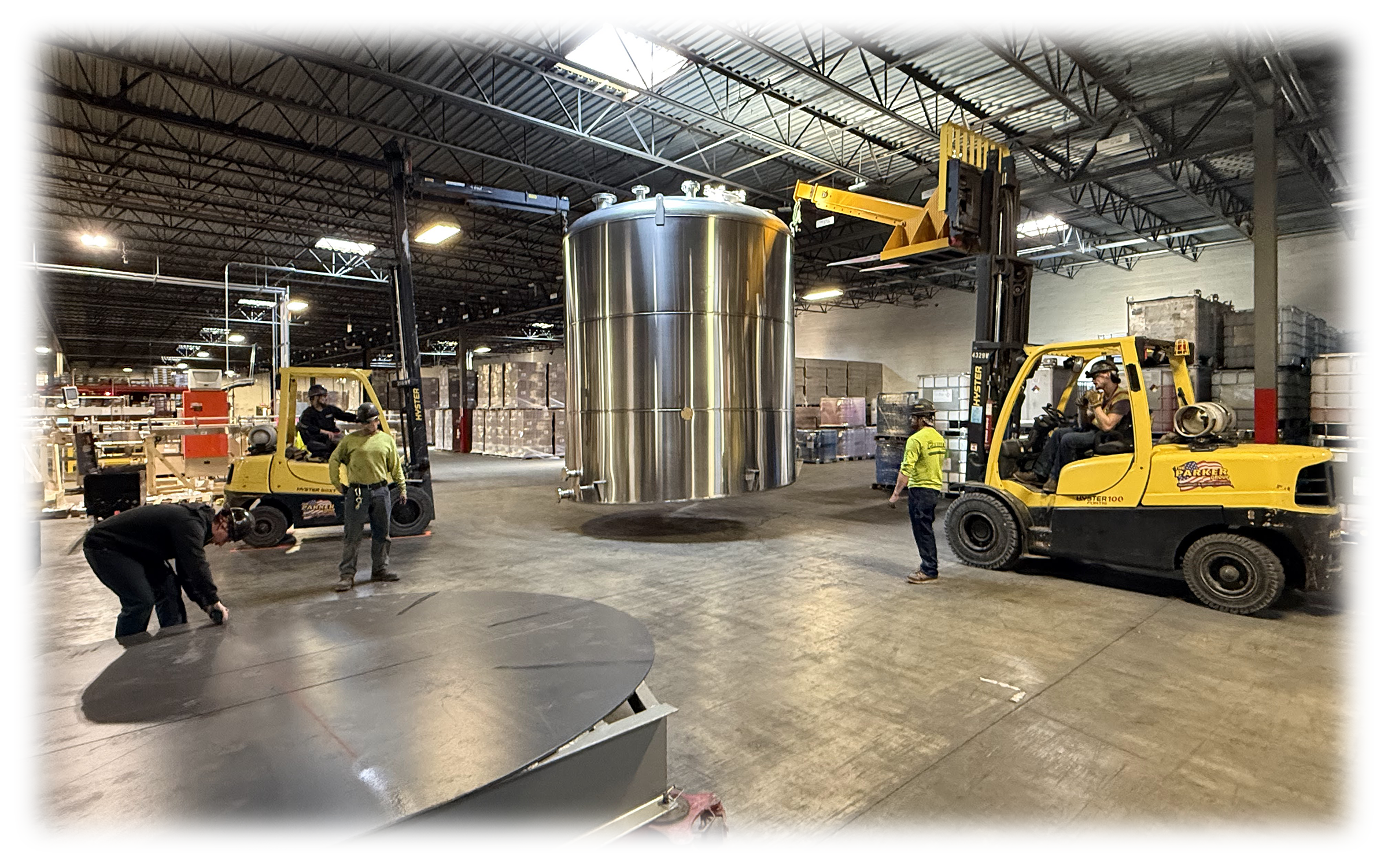 Large-scale industrial infrastructure installation featuring new piping and machinery setup.