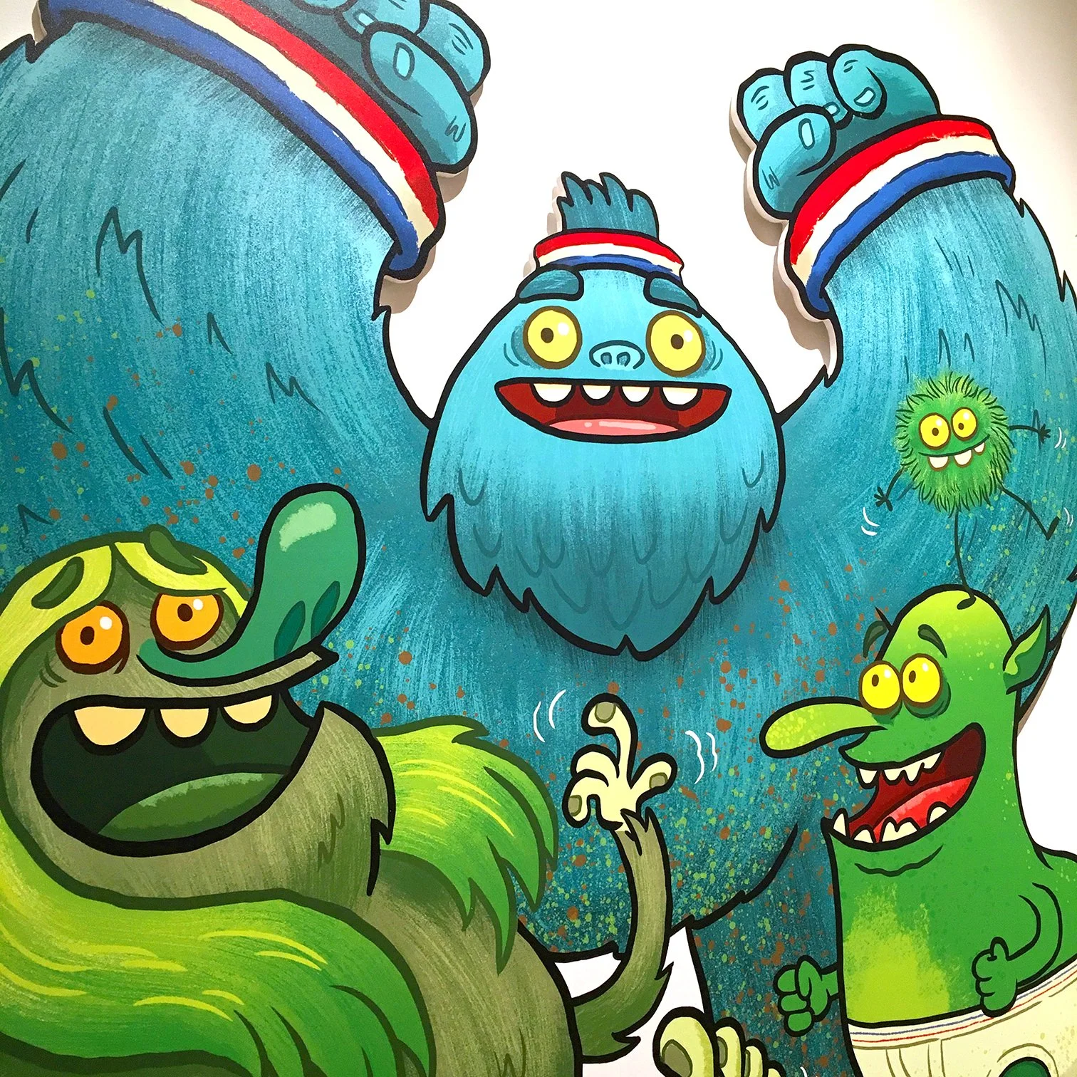 Colorful cartoon illustration of friendly monsters, including a large blue monster with a beard and smaller green monsters with big eyes and sharp teeth, all smiling and with playful expressions.