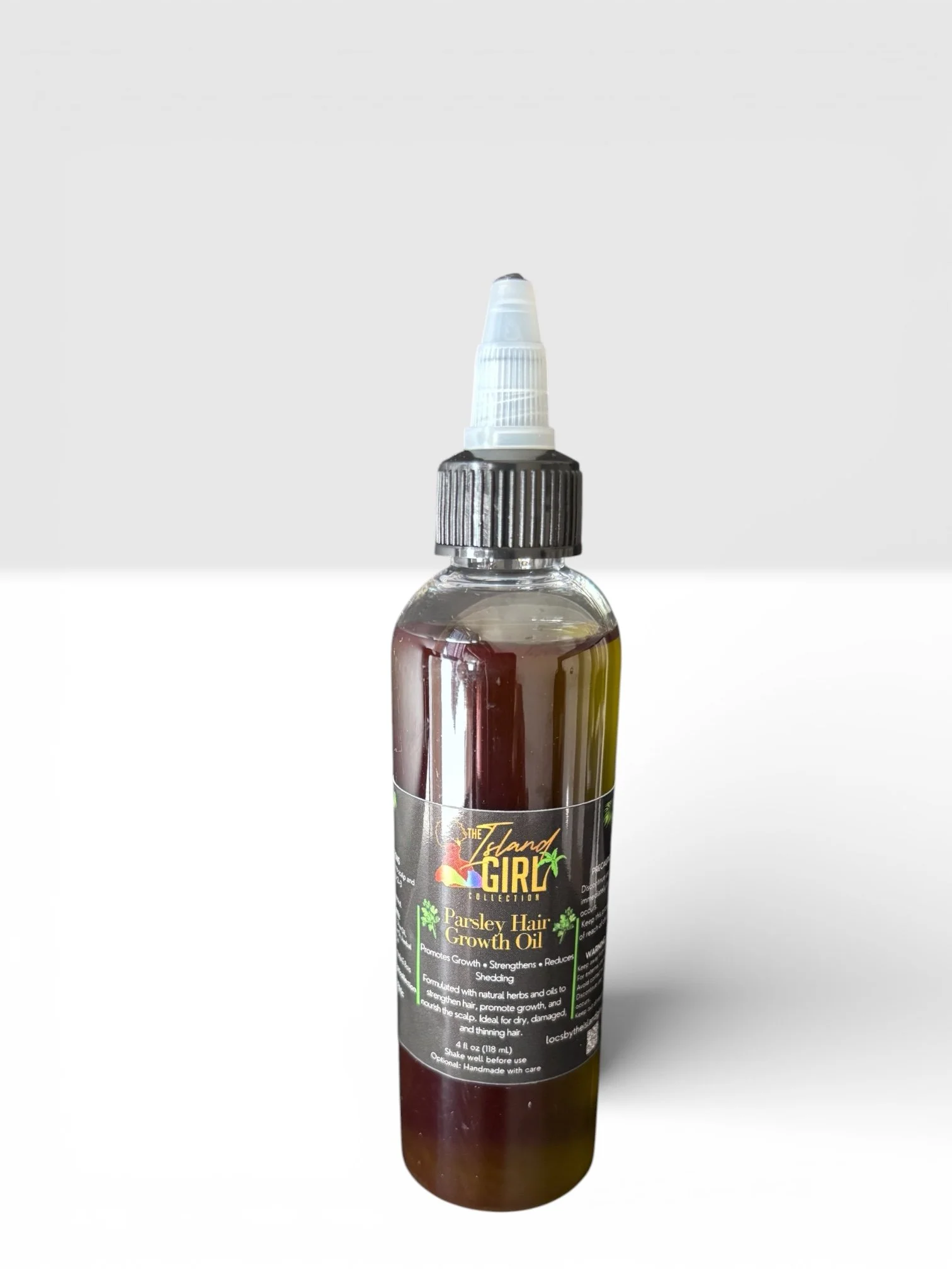 A bottle of Parsley Hair Growth Oil with a black label and a white pump top, containing greenish oil.