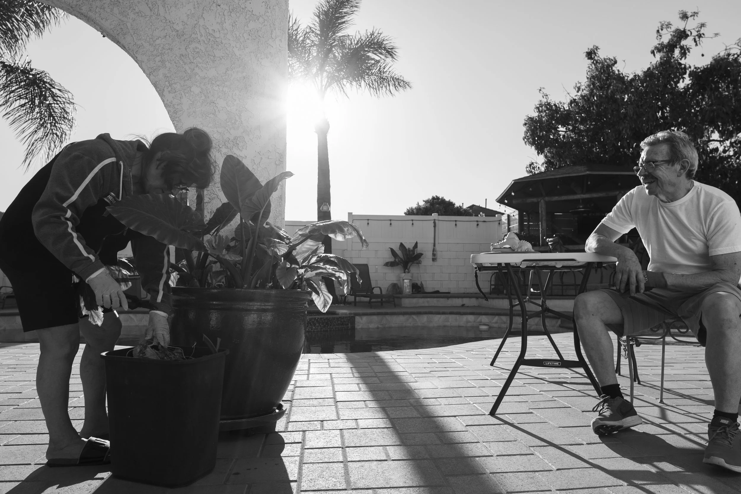 Now outside, my grandma tends to her various plants, and my grandpa joins her in the backyard as they have a conversation and enjoy the sun in anticipation for the coming months of summer where their backyard serves as a place of family, company, and