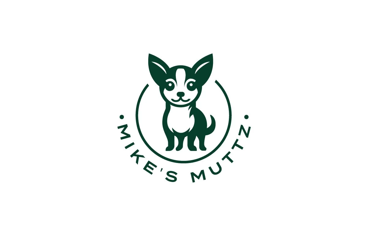 A logo for Mike's Mutt featuring a cartoon illustration of a small dog with large ears, inside a circle. The text "MIKE'S MUTT" curves around the bottom of the circle.