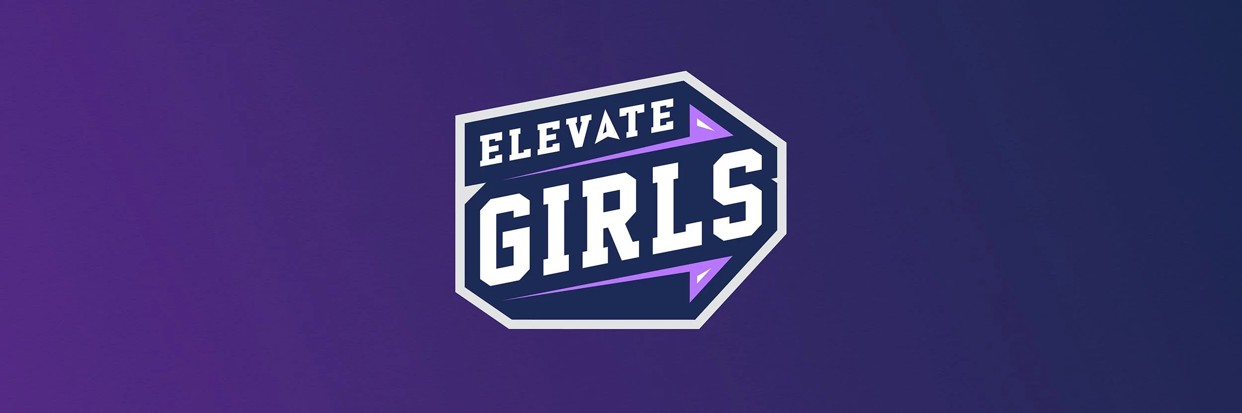 Logo with the text 'Elevate Girls' in bold white letters inside a geometric shape with purple accents on a purple background.