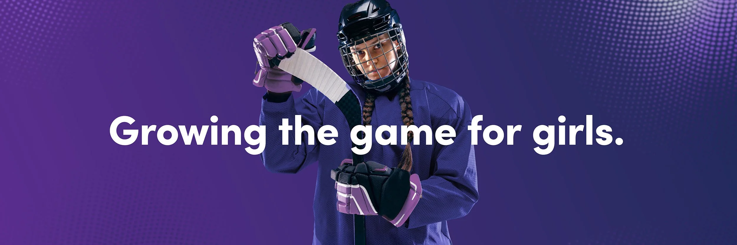A young girl dressed in hockey gear holding a hockey stick, with the text 'Growing the game for girls' over a purple background.