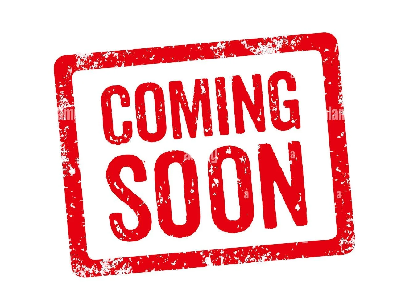 Red rubber stamp-style sign with the text 'Coming Soon' in capital letters.