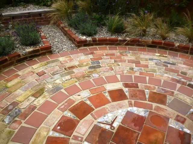 Circular patio with reclaimed bricks & paments