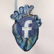 Graffiti artwork of a human heart with Facebook logo on it, painted on a wall.