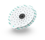 A round shower drain cover with small holes, black center, and a textured surface
