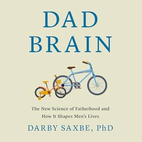 Book cover titled 'Dad Brain' by Darby Saxbe, PhD, with illustrations of a small yellow bike and a larger blue bike. Subtitle reads 'The New Science of Fatherhood and How It Shapes Men's Lives.'