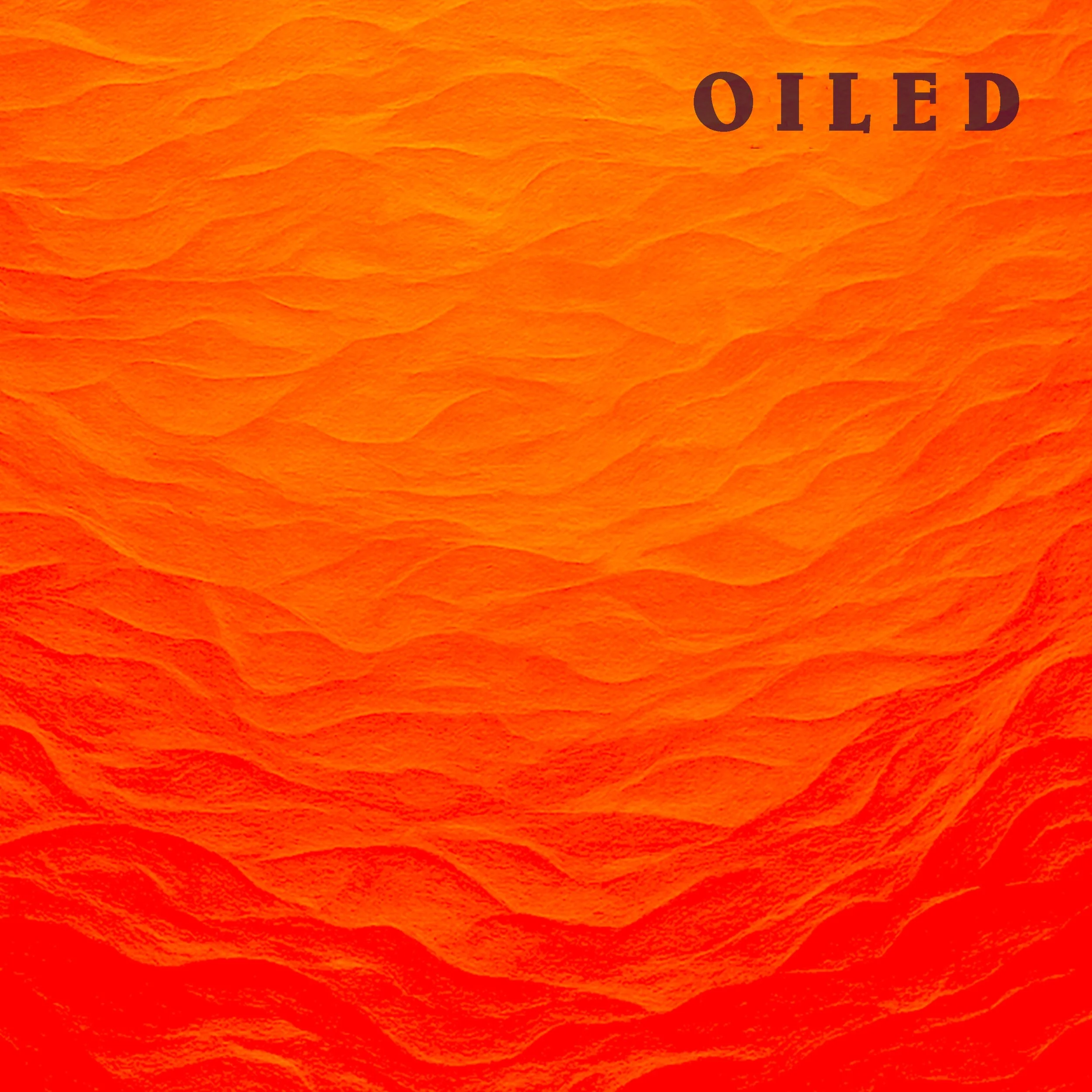 Close-up of an orange textured surface with the word 'OLED' in dark text on the top right corner.