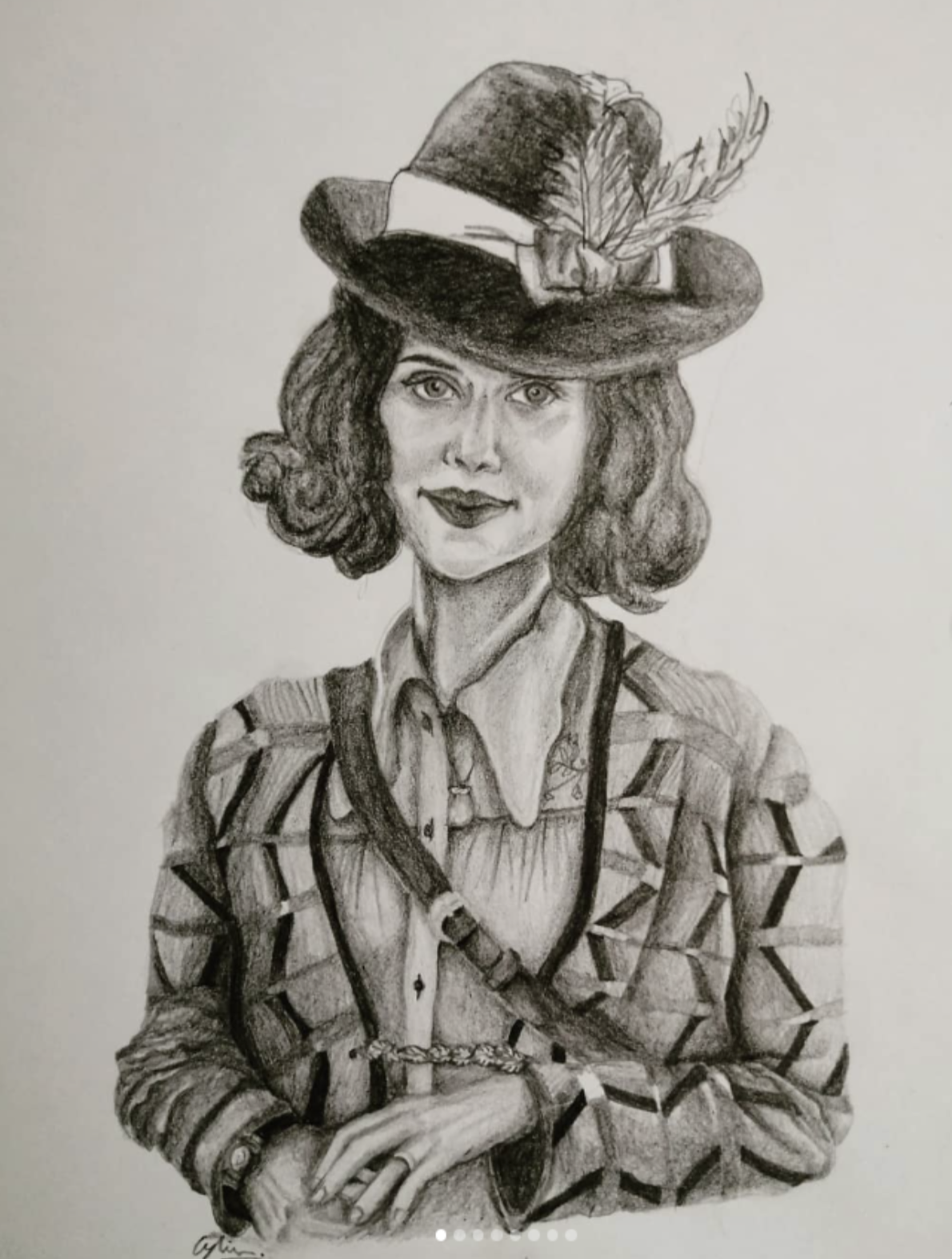 A pencil drawing of a woman with curly hair, wearing a patterned blazer over a button-up shirt, and a hat decorated with a feather and a ribbon. She has a calm expression and is sitting with her hands clasped.