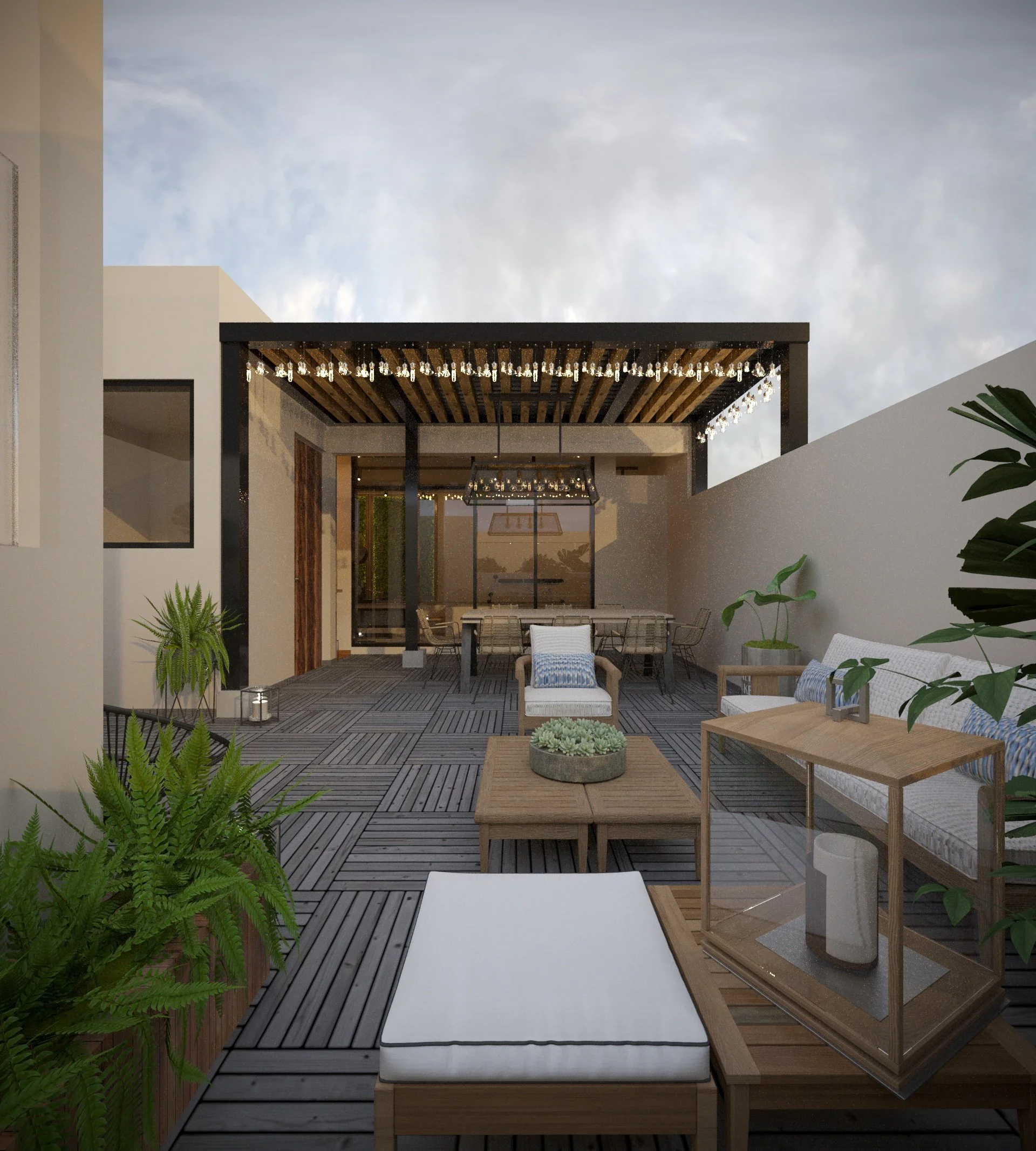 Modern outdoor patio with wooden decking, white lounge chairs with blue cushions, a wooden coffee table, potted plants, and a pergola with hanging glass light bulbs, against a cloudy sky.