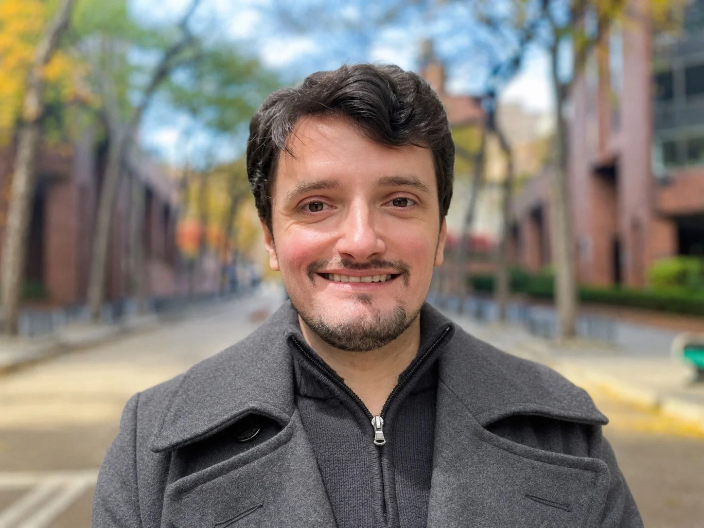A well-dressed man with a friendly smile