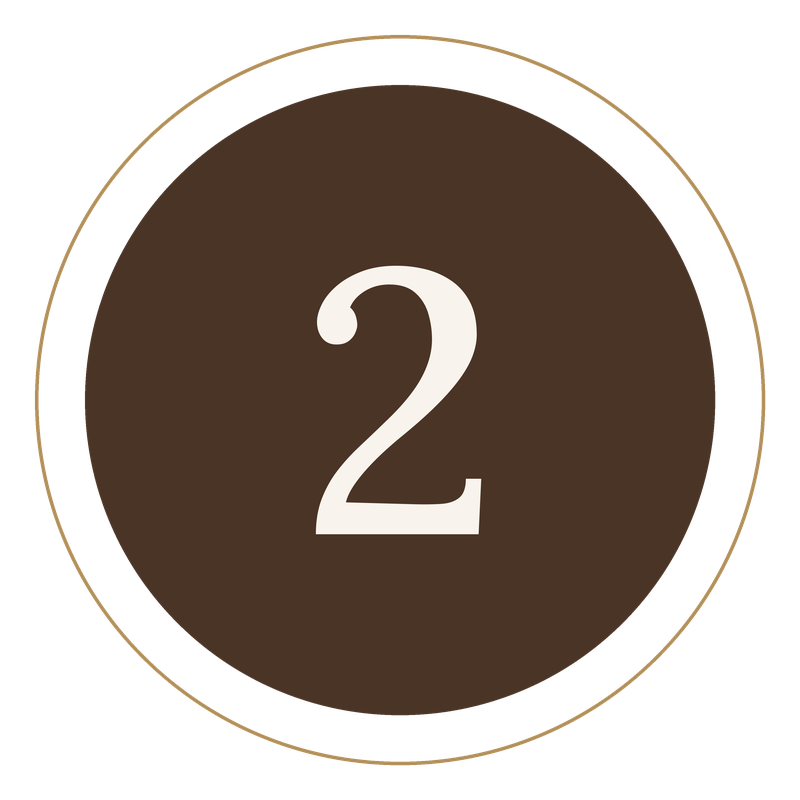 Number 2 displayed on a round, dark brown background with a gold and black border.