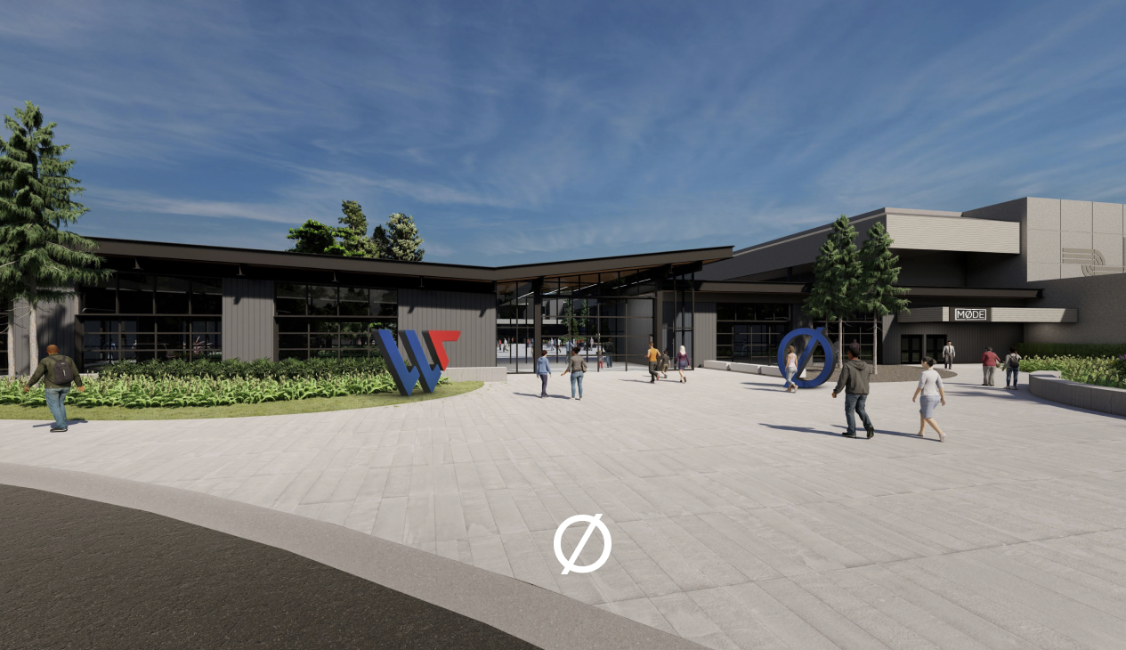 People walking towards a modern building entrance with large Google and Android logos outside on a sunny day.