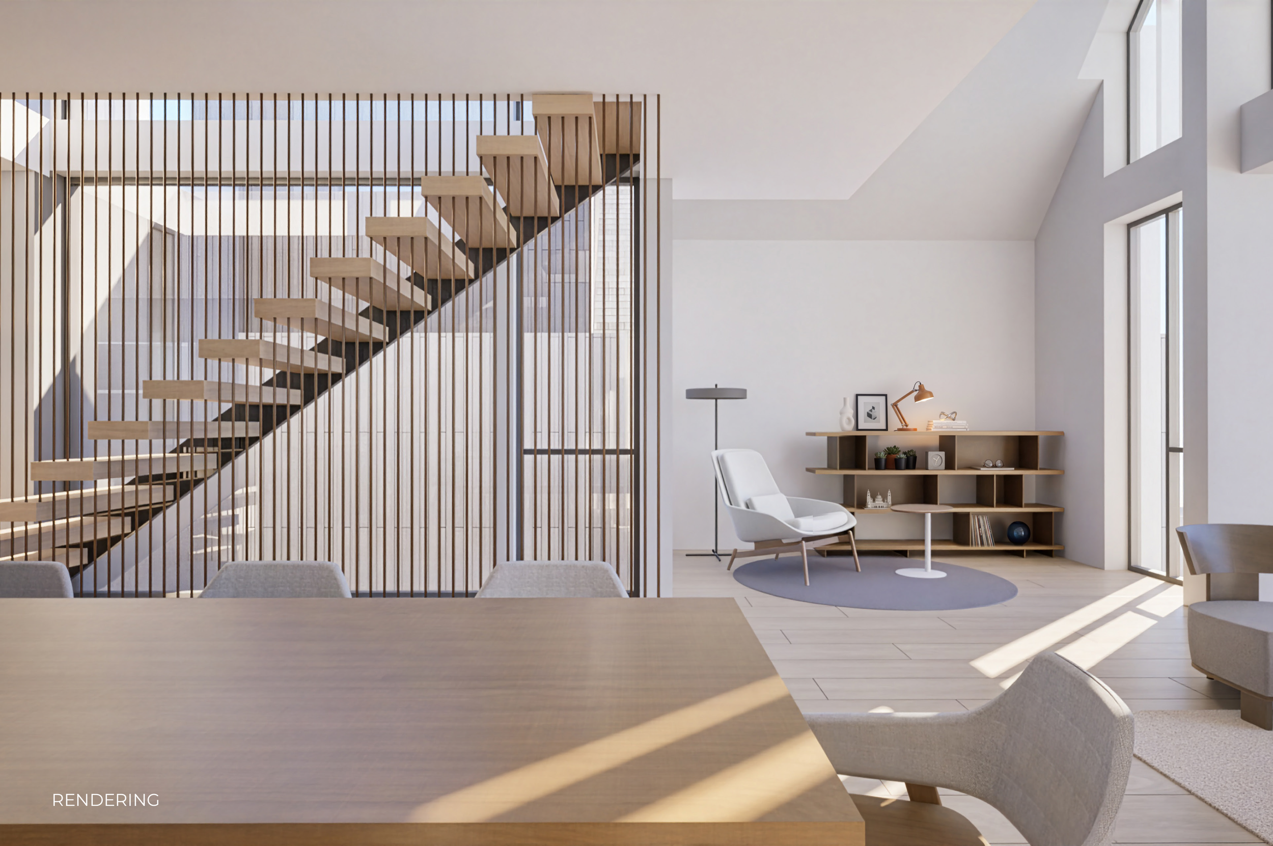 Modern living space with open staircase, large windows, white walls, and minimal furniture including a white chair, a wooden side table, and a bookshelf with decorative items.