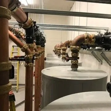 Hot water heating system with pipes and tanks in a facility. installed in Vancouver