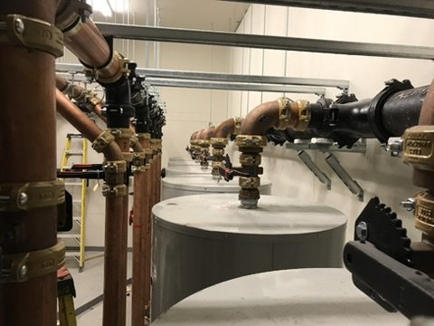 Hot water heating system with pipes and tanks in a facility. installed in Vancouver