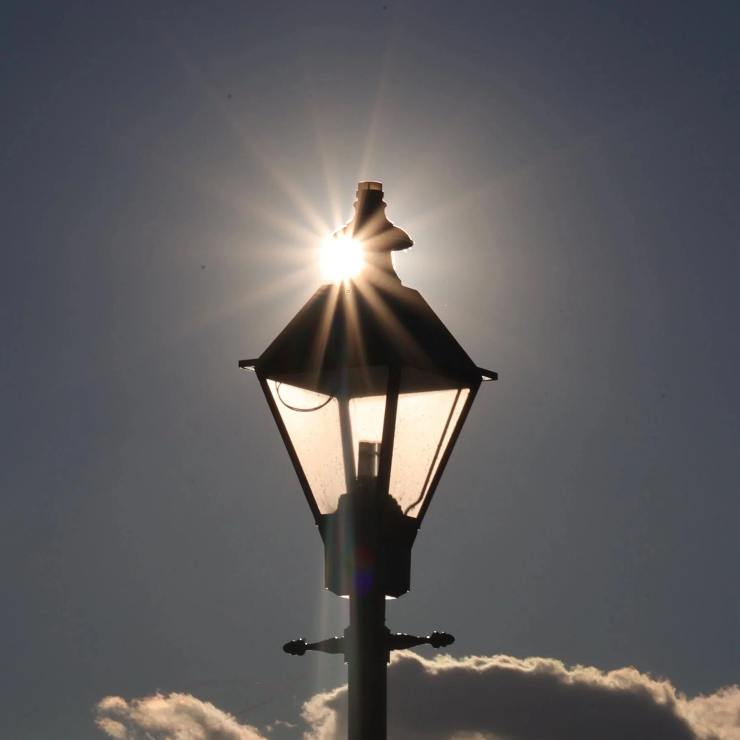 Lamp in front of a sunset