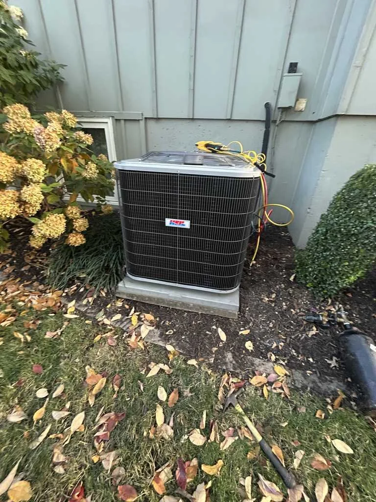 Oranssi technician working on a roof project