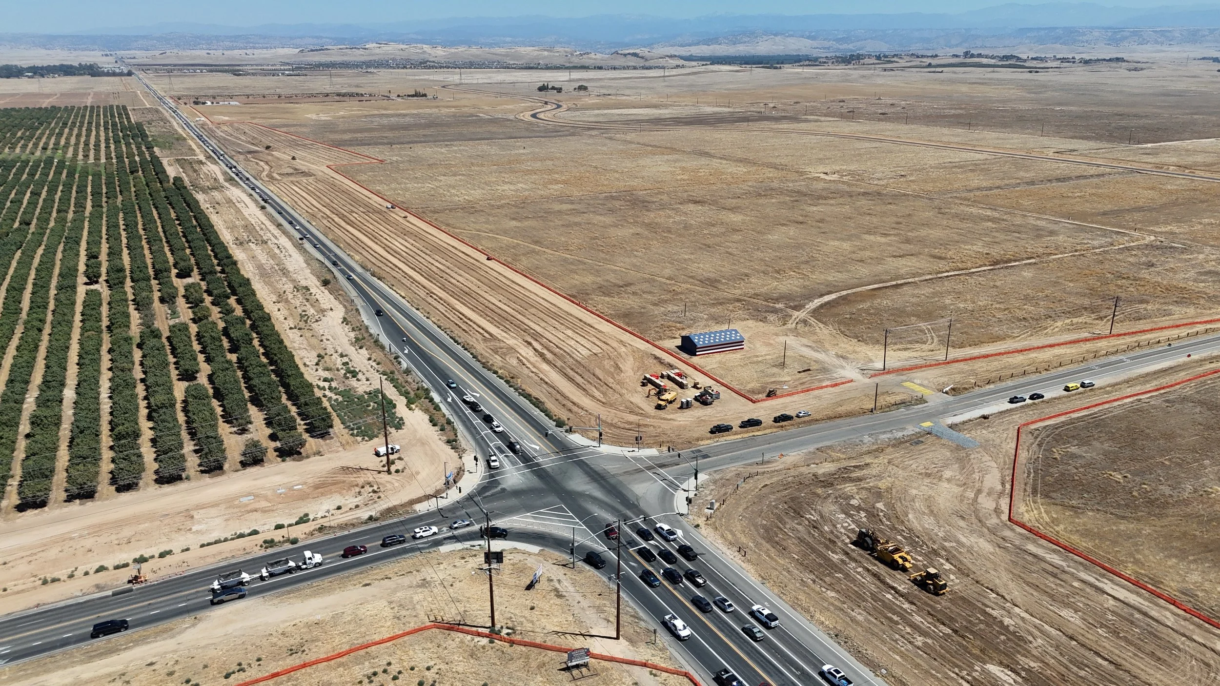 Ave 12 and State Route 41 intersection with the orange fencing on the exterior soil.