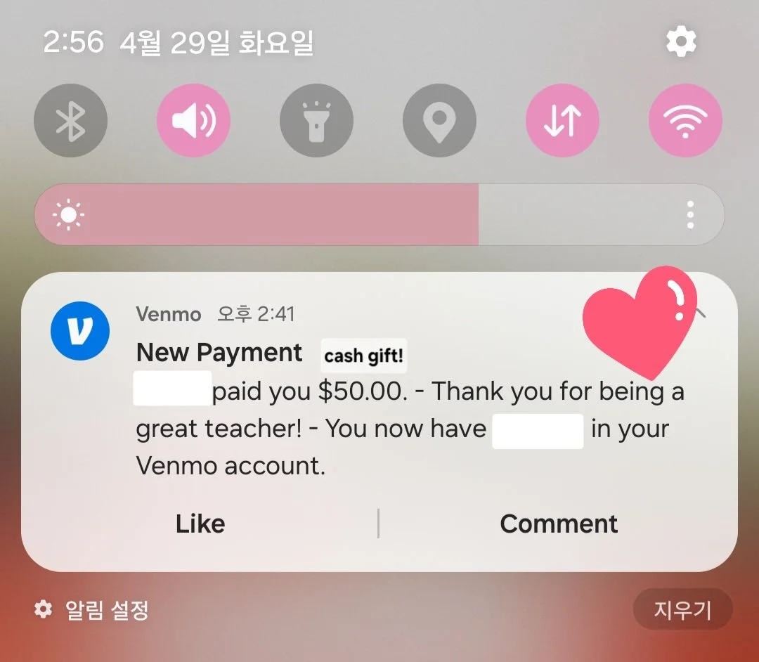 Screenshot of a phone notification screen showing a Venmo payment confirmation of $50.00, with a pink heart sticker on the top right corner.