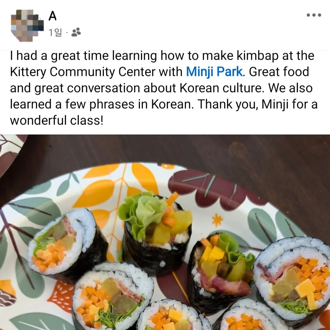 Plate of homemade sushi rolls filled with vegetables, wrapped in seaweed, on a patterned plate.