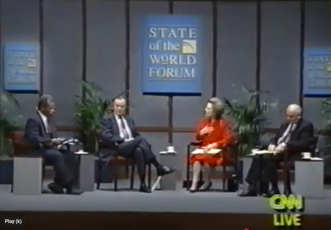 Panel discussion at the State of the World Forum, with four people on stage, four panelists, and CNN Live logo in the corner.