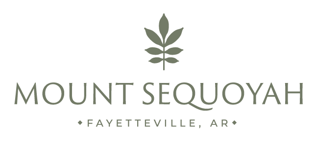 Logo for Mount Sequoyah in Fayetteville, Arkansas, featuring a stylized leaf above the text.
